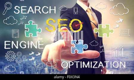 Businessman pointing at SEO (search engine optimization) Stock Photo