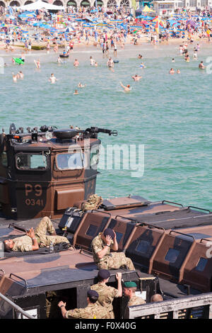 Bournemouth, UK. 22 August 2015. Royal Marines Commando relaxing on RM Landing Craft Vehicle Personnel MK5 P9-0341before beach assault at Bournemouth Air Festival Credit:  Carolyn Jenkins/Alamy Live News Stock Photo