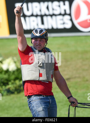 Aachen, Germany. 22nd Aug, 2015. Michael Brauchle of Germany gestures in the Marathon Driving Competition during the FEI European Championships in Aachen, Germany, 22 August 2015. Photo: Uwe Anspach/dpa/Alamy Live News Stock Photo