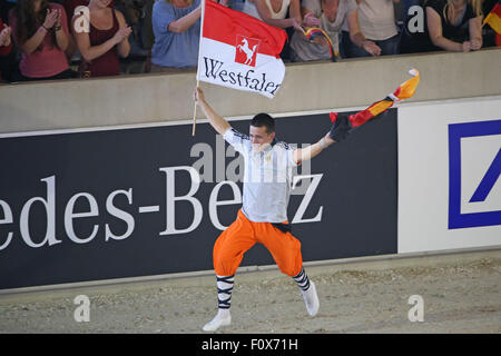 Aachen, Germany. 22nd Aug, 2015. Gold medal winner Jannis Drewell of Germany celebrates after the Male Vaulters Final Freestyle Test during the FEI European Championships in Aachen, Germany, 22 August 2015. Photo: Friso Gentsch/dpa/Alamy Live News Stock Photo