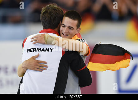 Aachen, Germany. 22nd Aug, 2015. Jannis Drewell (r) is glad about the victory in the Male Vaulters Final Freestyle Test during the FEI European Championships in Aachen, Germany, 22 August 2015. Photo: Uwe Anspach/dpa/Alamy Live News Stock Photo