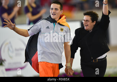 Aachen, Germany. 22nd Aug, 2015. Jannis Drewell and Simone Drewell of Germany are glad about the victory in the Male Vaulters Final Freestyle Test during the FEI European Championships in Aachen, Germany, 22 August 2015. Photo: Uwe Anspach/dpa/Alamy Live News Stock Photo