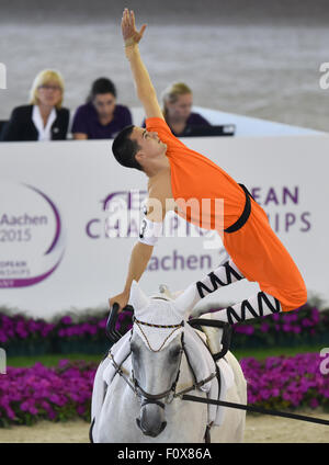Aachen, Germany. 22nd Aug, 2015. Jannis Drewell of Germany performs on his horse Diabolus in the Male Vaulters Final Freestyle Test during the FEI European Championships in Aachen, Germany, 22 August 2015. Photo: Uwe Anspach/dpa/Alamy Live News Stock Photo