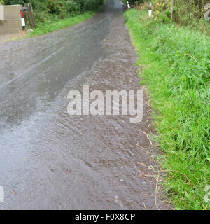 Titley, Herefordshire, UK. 22nd August, 2015. After a day of very hot and humid weather a summer thunderstorm brought torrential rain down at Titley Herefordshire at 6.15pm causing flooding on many country lanes that lack drains. Stock Photo