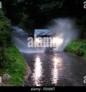 Titley, Herefordshire, UK. 22nd August, 2015. After a day of very hot and humid weather a summer thunderstorm brought very dark skies and torrential rain down at Titley Herefordshire at 6.15pm causing flooding on many country lanes that lack drains. Stock Photo