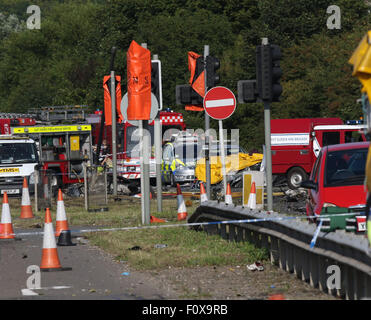 Shoreham, UK. 22nd August, 2015. GV Showing the scene of the A27 Shoreham Seven People have been killed after a plane crashed on to the A27 whilst displaying  Police have closed the road The Air crashed at an event marking the Second World War at Shoreham Airshow  today.    Seven people have died after a Hawker Hunter jet crashed into several vehicles during Shoreham Airshow.  South East Coast Ambulance Service said the victims all died at the scene, with a further person being taken to hospital in critical condition.   Credit:  jason kay/Alamy Live News Stock Photo