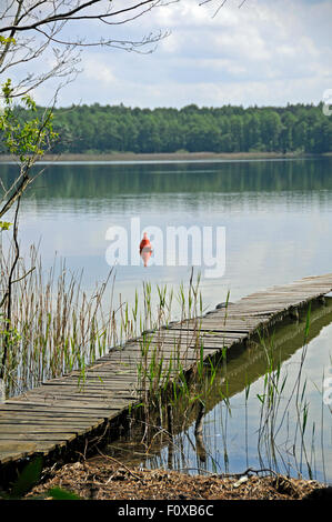 Old wooden pier on Powidz lake, Poland Stock Photo