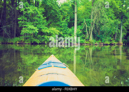 Vintage photo of beautiful Krutynia river landscape photographed from kayak. Photo with vintage mood effect Stock Photo