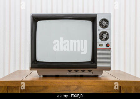 Vintage portable television set on a old craftsman style table. Stock Photo