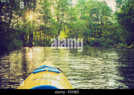 Vintage photo of beautiful Krutynia river landscape photographed from kayak. Photo with vintage mood effect Stock Photo