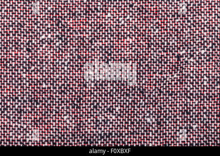 background from red black and white woolen neps fabric close up Stock Photo