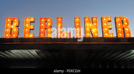 Berliner sign in lights with sky behind, bar serving bier Stock Photo