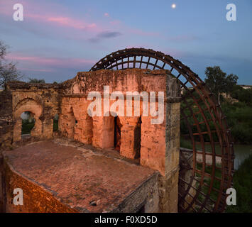 Moonrise over Guadalquivir River with Roman Albolafia Waterwheel at dusk in Cordoba Stock Photo