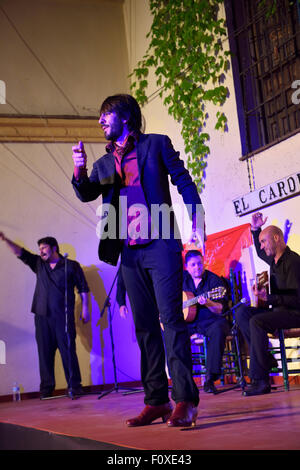 Male Flamenco tap dancer on stage at night in an outdoor courtyard in Cordoba Spain Stock Photo