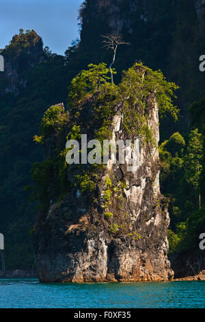 KARST FORMATIONS drop into CHEOW EN LAKE in KHAO SOK NATIONAL PARK - THAILAND Stock Photo