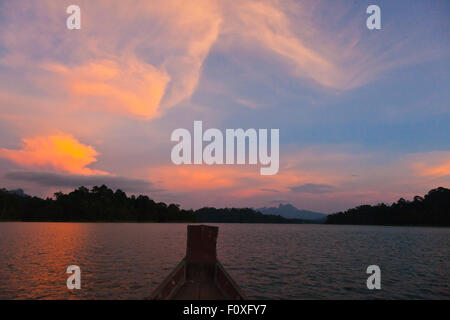 SUNSET on KLONG SAENG of CHEOW EN LAKE in KHAO SOK NATIONAL PARK - THAILAND Stock Photo