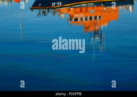Reflex of boat in harbour, Howth, Ireland, Europe Stock Photo