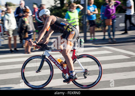 Copenhagen, Denmark, August 23rd, 2015. A triathlete has just started on the 180 km cycle stage in KMD Ironman Copenhagen after having finieshed the 3.8 km swim stage. Credit:  OJPHOTOS/Alamy Live News Stock Photo