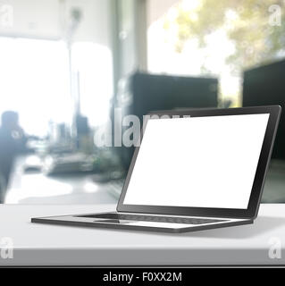 3d Laptop computer with blank screen on laminate table and blurred background Stock Photo