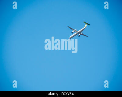 airplane trails on blue sky and white clouds Stock Photo