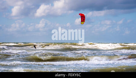 Wakeboarder making tricks on waves at baltic sea Stock Photo