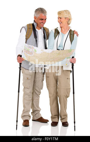 cheerful middle aged couple checking directions on a map isolated on white background Stock Photo