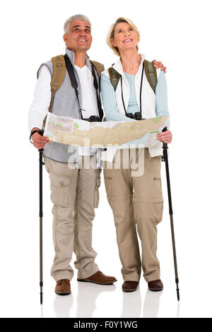 beautiful middle aged couple with backpacks and map on white background