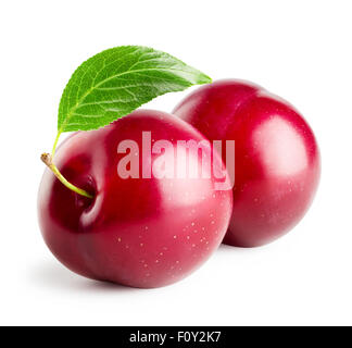 Two plums with leaf isolated on white background Stock Photo