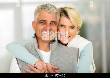 close up portrait of mature couple hugging Stock Photo