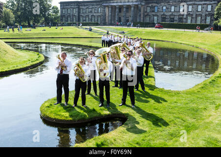Edinburgh, UK. 23rd Aug, 2015. 12 Scottish Brass Bands perform the same pieces of music simultaneously at different locations along he Water of Leith. Pictured Whitburn Band performing at the Scottish Gallery of Modern Art Credit:  Richard Dyson/Alamy Live News Stock Photo