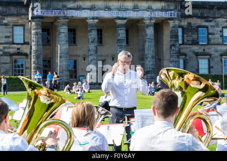 Edinburgh, UK. 23rd Aug, 2015. 12 Scottish Brass Bands perform the same pieces of music simultaneously at different locations along he Water of Leith. Pictured Whitburn Band performing at the Scottish Gallery of Modern Art Credit:  Richard Dyson/Alamy Live News Stock Photo
