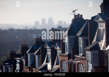 Muswell Hill houses with view to skyline of Canary Wharf financial district London England UK Stock Photo