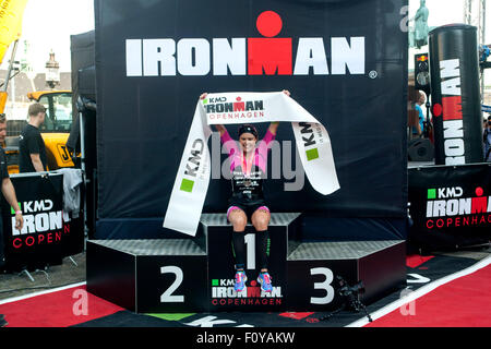 Copenhagen, Denmark, August 23rd, 2015. A proud triathlete Michelle Vesterby, Denmark, poses for photographers at the finishing line in KMD Ironman Copenhagen 70.3. Weesterby won women's race  in 08:59:49 H. Credit:  OJPHOTOS/Alamy Live News Stock Photo