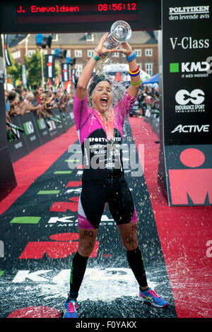 Copenhagen, Denmark, August 23rd, 2015. A happy triathlete Michelle Vesterby, Denmark, poors a large glass of beer over herself at the finishing line in KMD Ironman Copenhagen 70.3. Weesterby won women's race  in 08:59:49 H. Credit:  OJPHOTOS/Alamy Live News Stock Photo