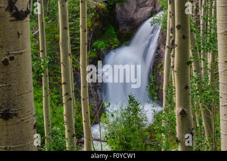 Snow melt rushes down in waterfalls from Un Compaghre peak near Gunnison, Colorado Stock Photo