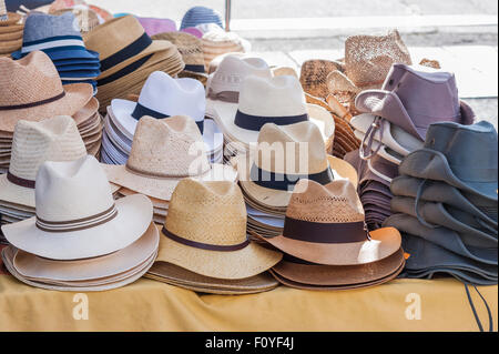 All kinds of hats for men on sale in a stand of a local market Stock Photo