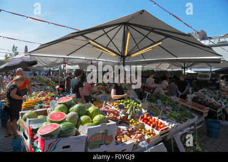 Fruit and vegetable stalls at Torvehallerne, the covered food market,  at Israels Plads in Copenhagen on a sunny summer morning. Stock Photo