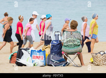 Pensioners daily keep fit class on Las Canteras beach in Las Palmas, Gran Canaria, Canary Islands, Spain Stock Photo