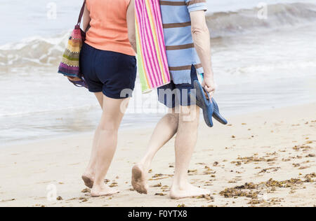 Couple walking on beach in Spain Stock Photo