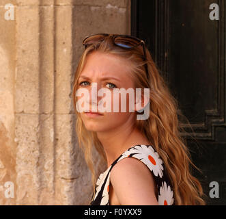 stunning young blonde girl with sunglasses on her head pale complexion. Stock Photo