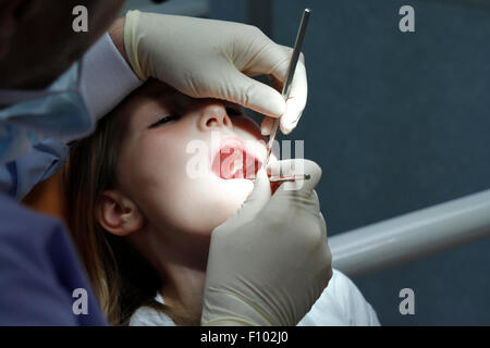 CHILD RECEIVING DENTAL CARE Stock Photo