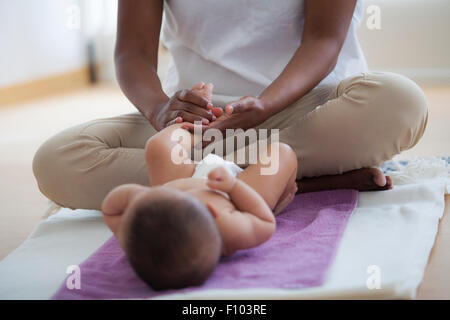 INFANT BEING MASSAGED Stock Photo