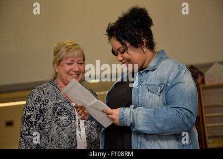 Students getting their results from teacher Stock Photo