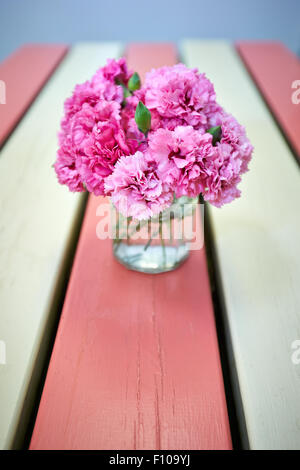 Pink carnations on a table at the Rectory Farm Cafe in Stanton St John, Oxforshire Stock Photo