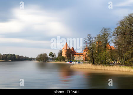 TRAKAI, LITHUANIA - APRIL 29, 2015 : View of Galve Lake with reflection of Trakai Island Castle which built in 14th century. Stock Photo