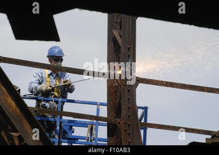 demolition of an old railway iron bridge with plasma cutting flame (Milan, Italy) Stock Photo