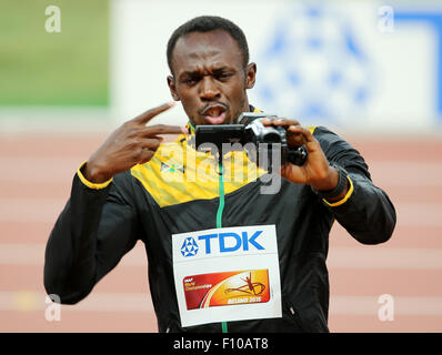 Beijing, China. 24th Aug, 2015. Jamaica's Usain Bolt takes a video during the medal ceremony of the men's 100m final during the Beijing 2015 IAAF World Championships at the National Stadium, also known as Bird's Nest, in Beijing, China, 24 August 2015. Bolt won the gold medal. Credit:  dpa picture alliance/Alamy Live News Stock Photo