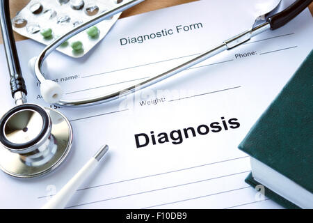 Diagnistic form with Diagnosis and stethoscope. Medicine concept. Stock Photo