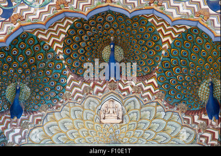 Jaipur, India. The  City Palace Pritam Niwas Chowk courtyard; detail of the Northwest gate, dedicated to Lord Vishnu with carved and painted detail of peacocks. Vishnu is represented in marble. Stock Photo