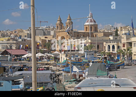 Parish Church of Our Lady seen along the waterfront, fishing village of Marsaxlokk, Malta. Stock Photo